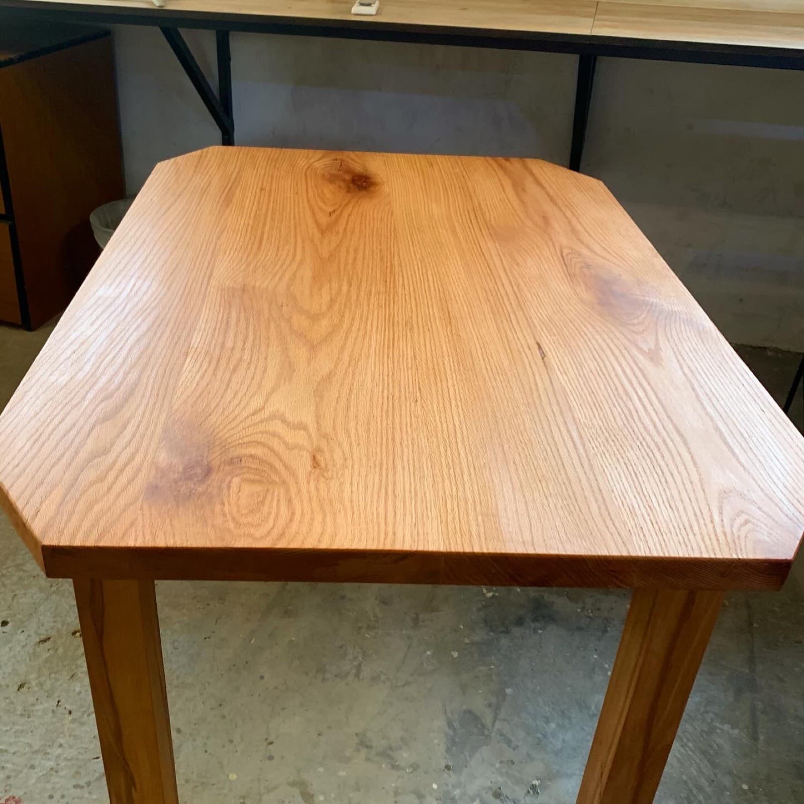 A solid-wood side table made by hand in the workshop